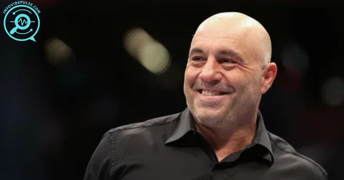 Joe Rogan wearing headphones, speaking into a microphone during a podcast recording in 2025, with a dark studio background and warm lighting.
