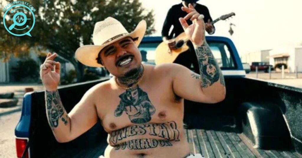That Mexican OT shirtless in a cowboy hat sitting in a truck bed.